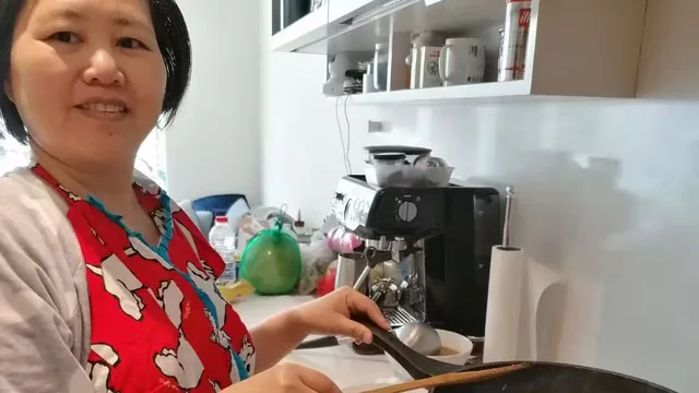 Jenny cooking a fresh meal in a client's kitchen