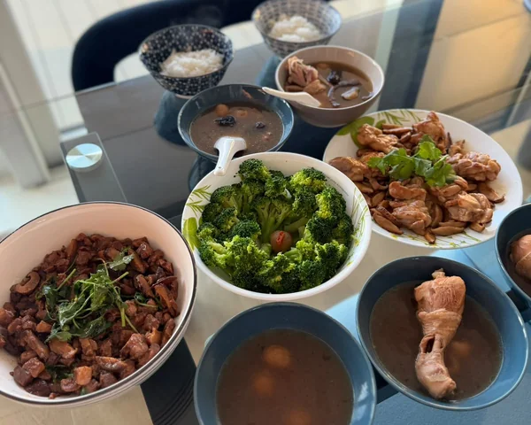 A day of confinement meals laid out - soups, greens, rice